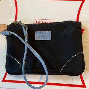 Baby blue and black coach wristlet